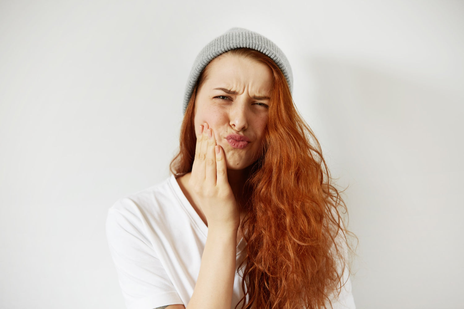 Frau mit Zahnschmerzen